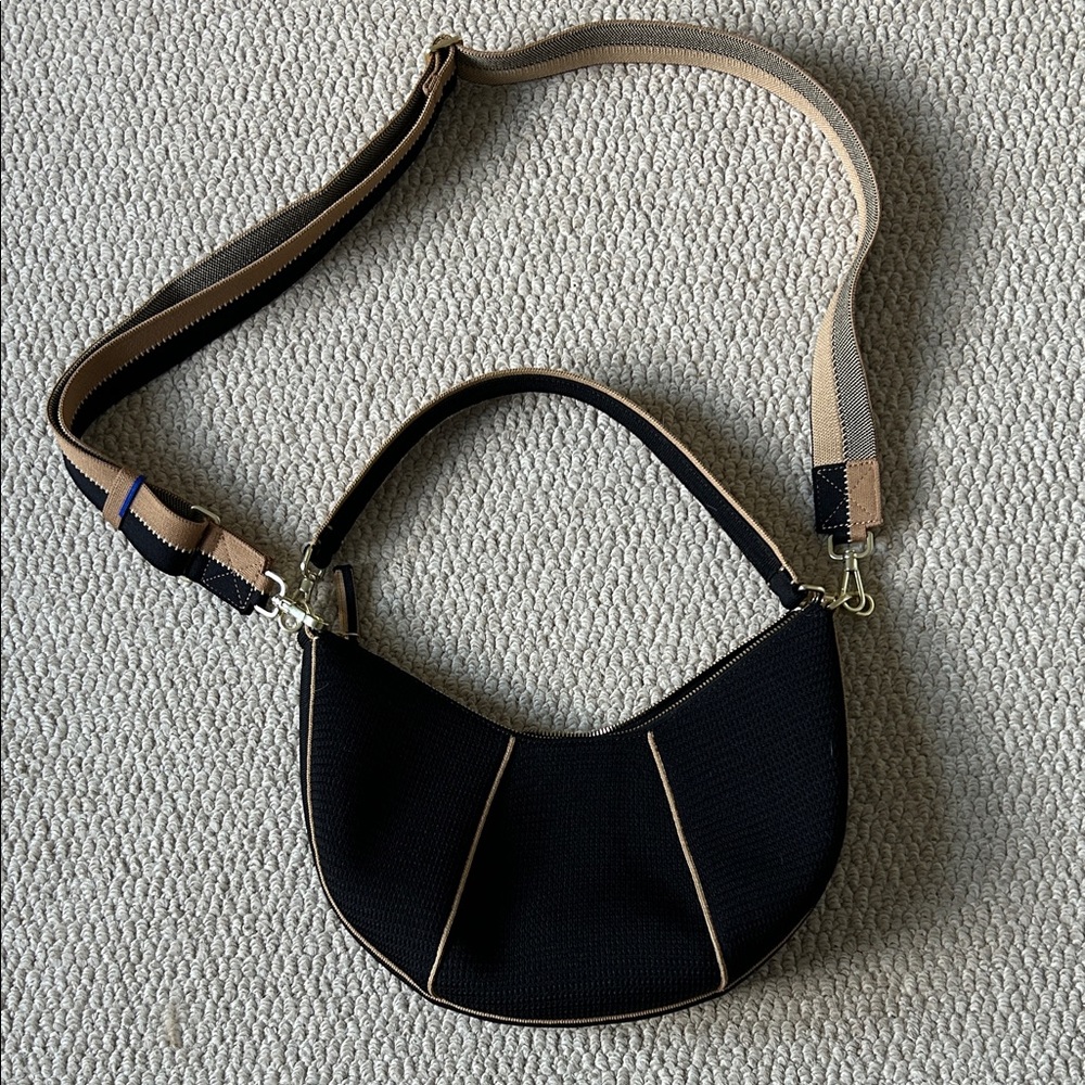 Rothy's Black Crescent Shoulder Bag with Tan Trim and Striped Strap